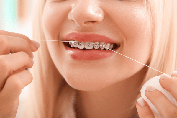 Flossing with braces