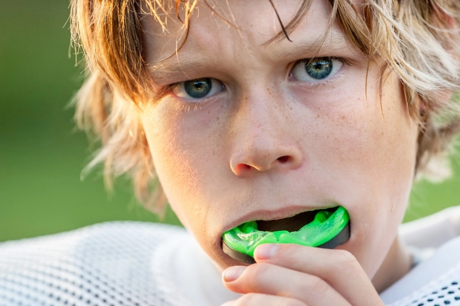 Boy wearing a mouthguard