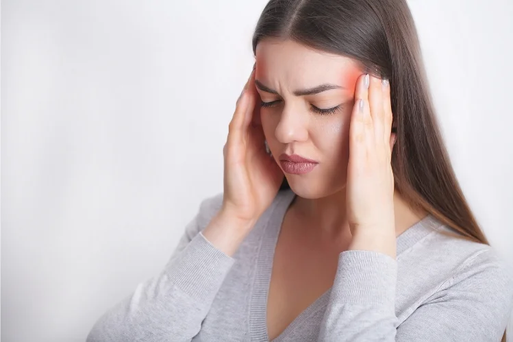 Woman suffering from a migraine